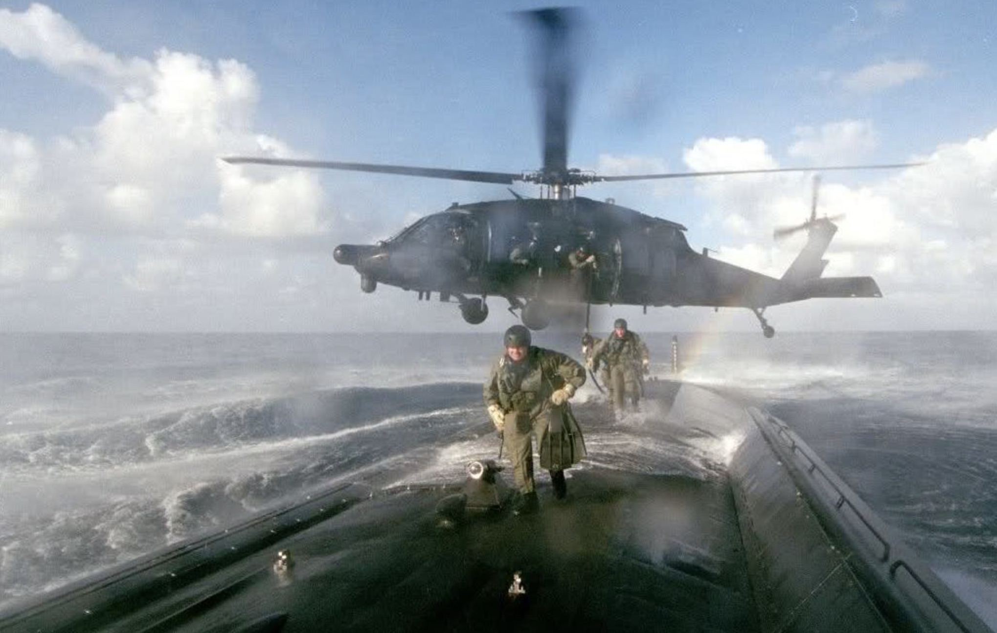 A MH-60L from 160th SOAR deploys an ODA from 7th SFG(A) on board a U.S. submarine for a joint exercise. 